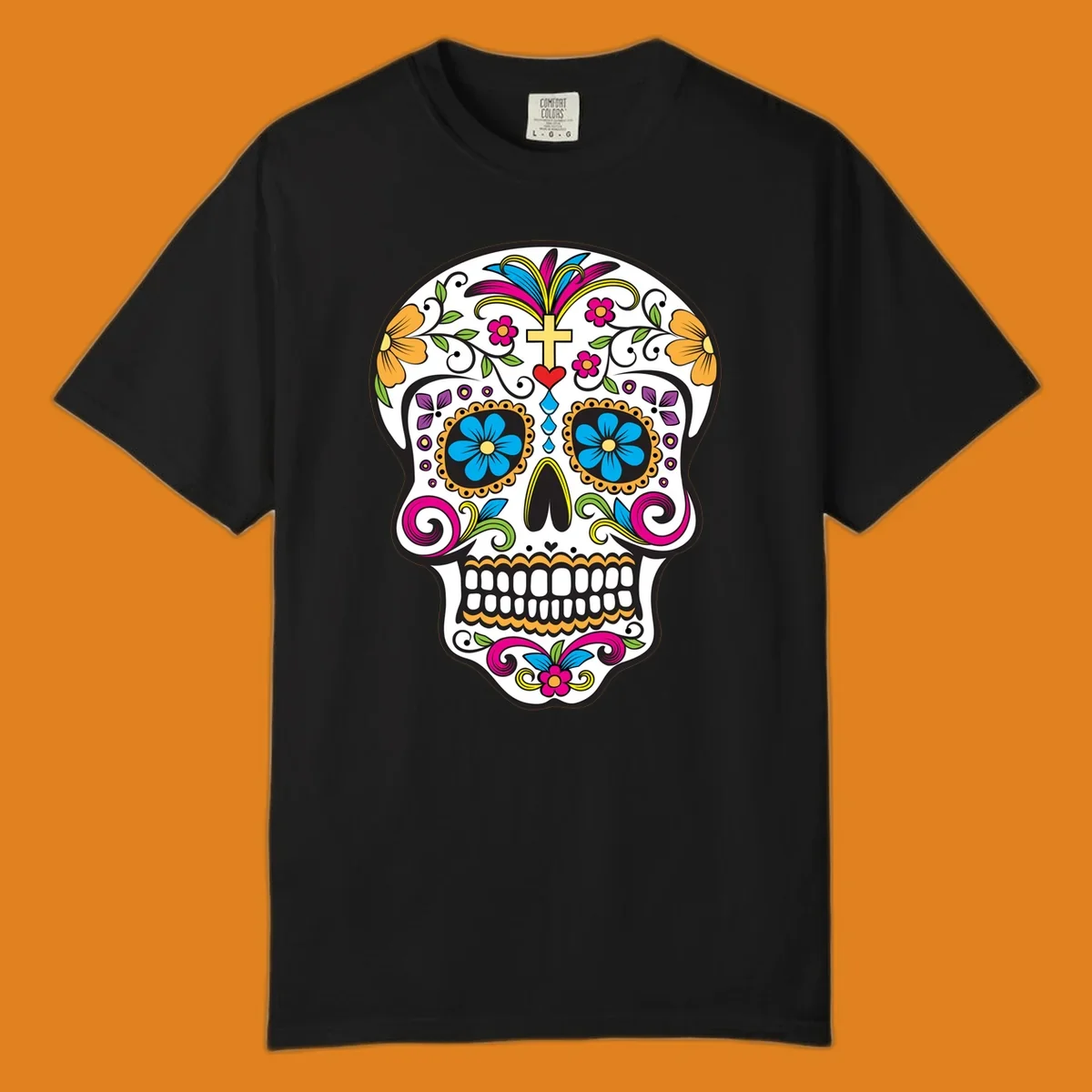 A vibrant sugar skull calavera illustration with colorful flowers, green leaves, a golden cross, and blue tears.