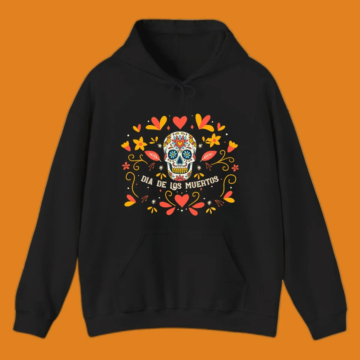 A colorful Día de los Muertos sugar skull with a heart on its forehead, surrounded by a symmetrical frame of red hearts, yellow flowers, and leaves, with 'DIA DE LOS MUERTOS' text below.