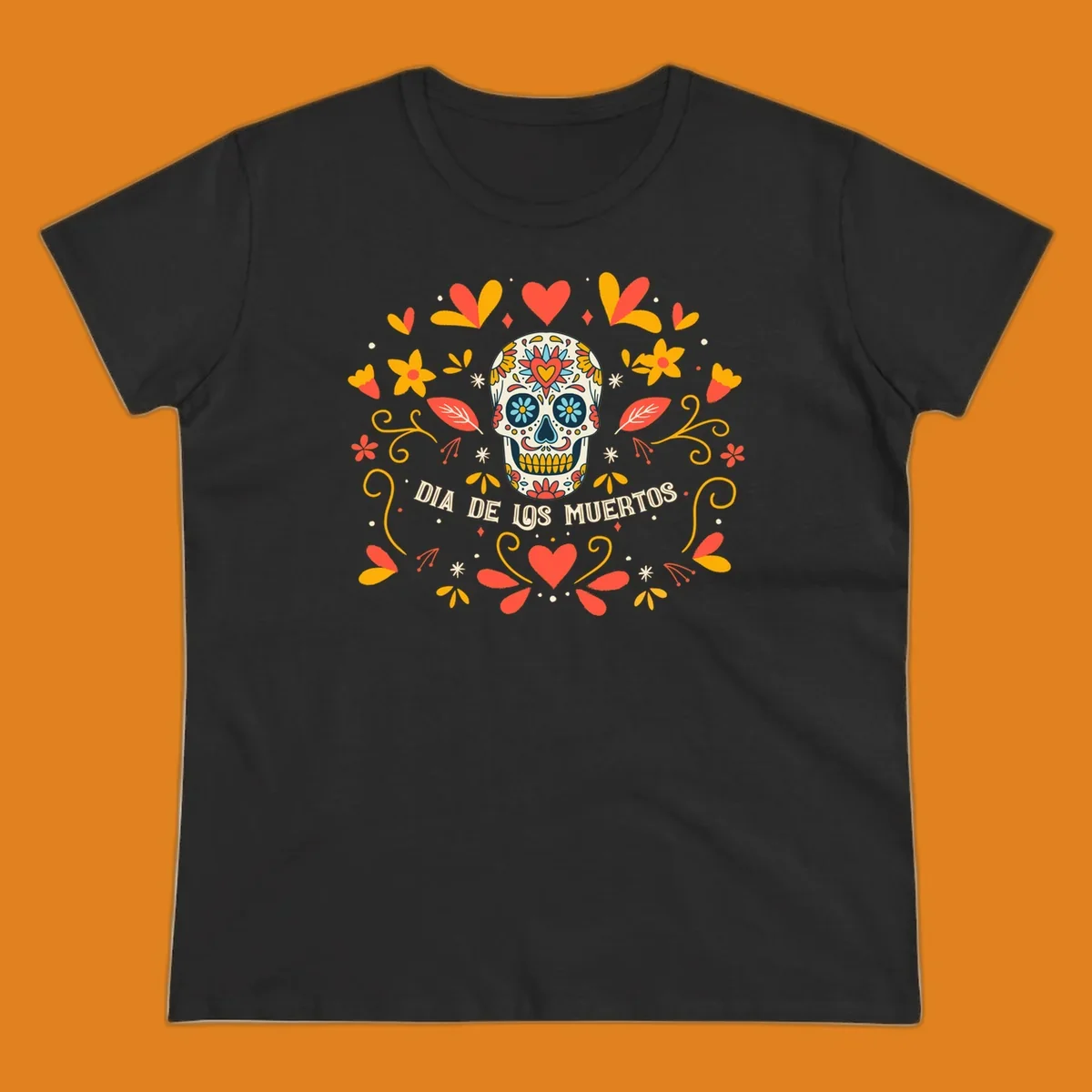 A colorful Día de los Muertos sugar skull with a heart on its forehead, surrounded by a symmetrical frame of red hearts, yellow flowers, and leaves, with 'DIA DE LOS MUERTOS' text below.