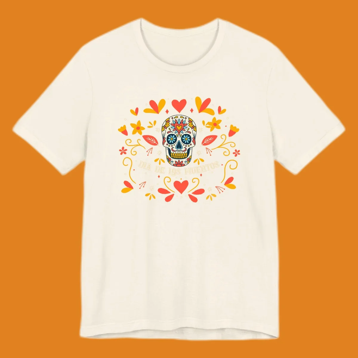 A colorful Día de los Muertos sugar skull with a heart on its forehead, surrounded by a symmetrical frame of red hearts, yellow flowers, and leaves, with 'DIA DE LOS MUERTOS' text below.