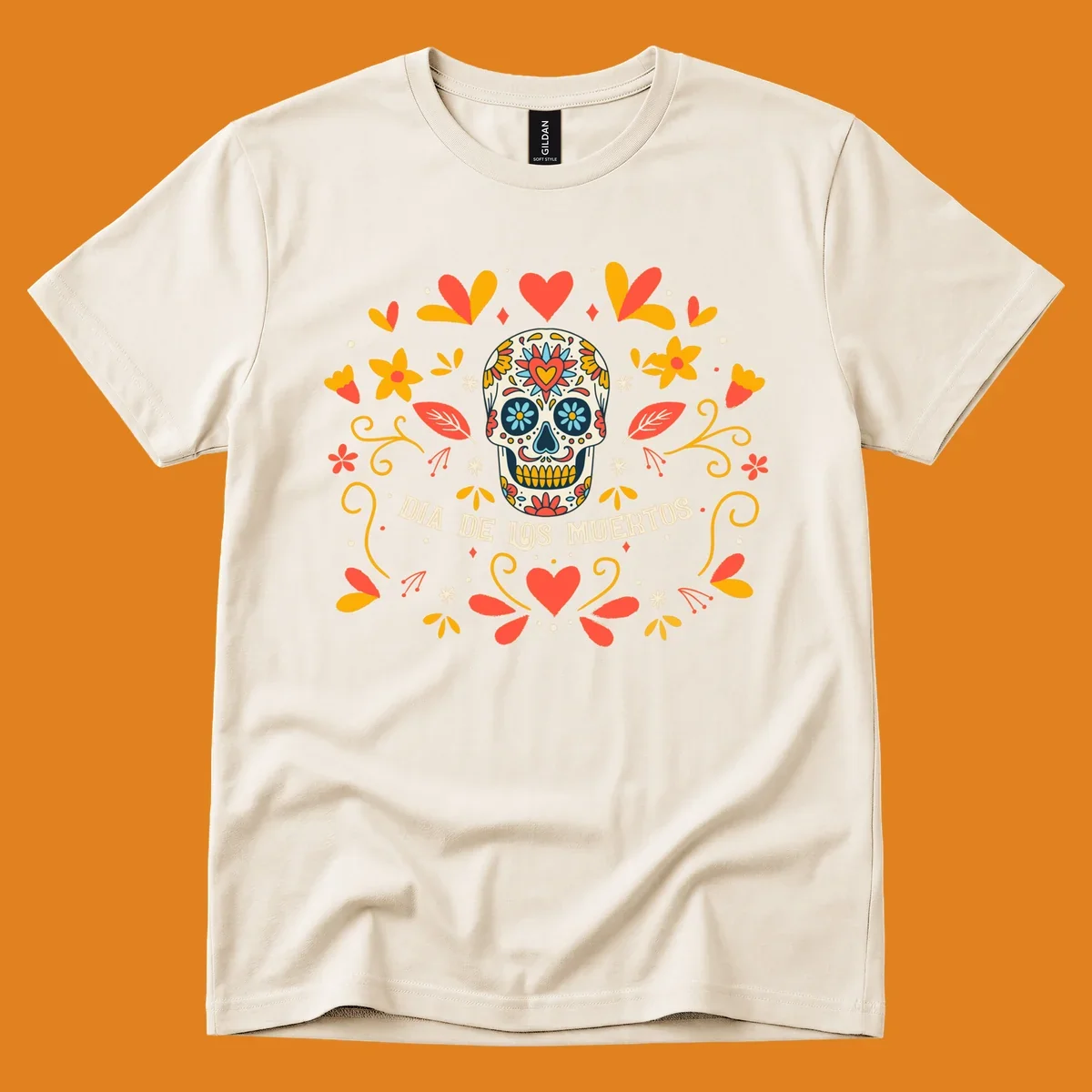 A colorful Día de los Muertos sugar skull with a heart on its forehead, surrounded by a symmetrical frame of red hearts, yellow flowers, and leaves, with 'DIA DE LOS MUERTOS' text below.