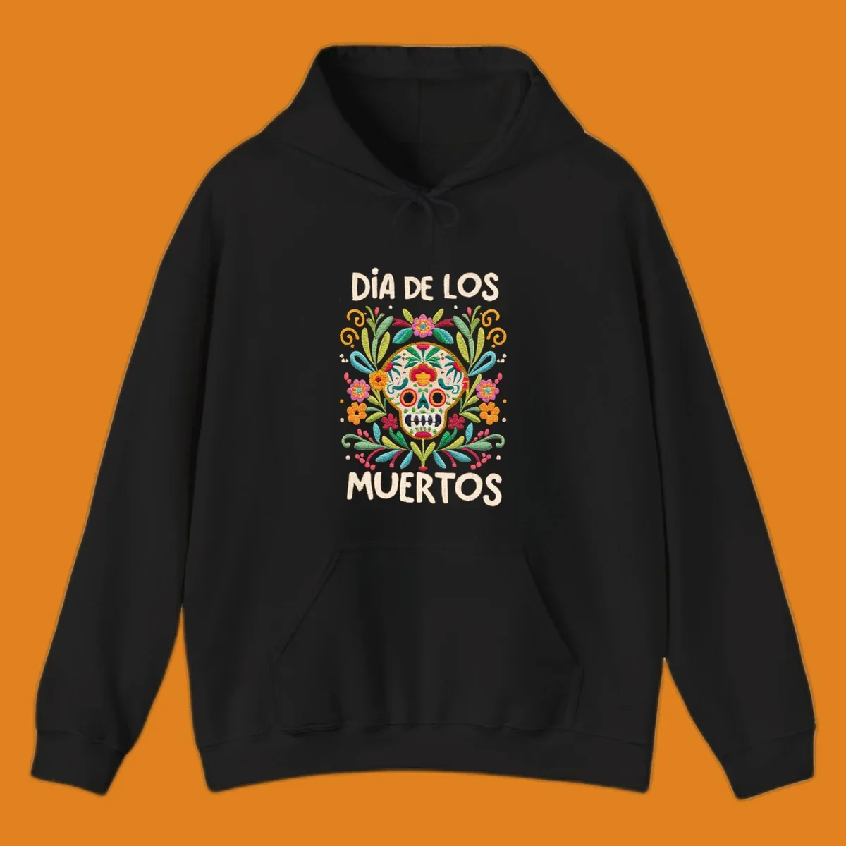 An embroidered-style Día de los Muertos sugar skull with colorful flowers and leaves, and the text "DÍA DE LOS MUERTOS".
