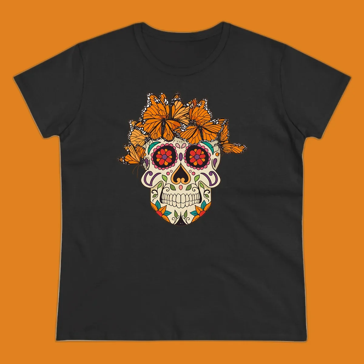 A cream sugar skull with colorful floral patterns and a crown of orange and black monarch butterflies.