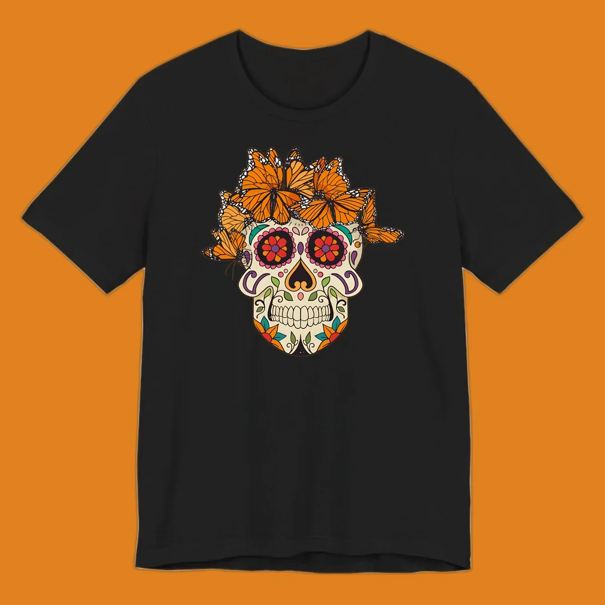 A cream sugar skull with colorful floral patterns and a crown of orange and black monarch butterflies.