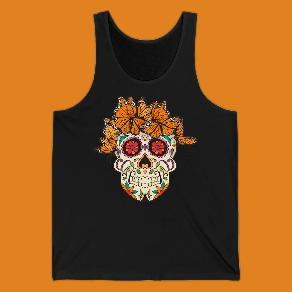 A cream sugar skull with colorful floral patterns and a crown of orange and black monarch butterflies.