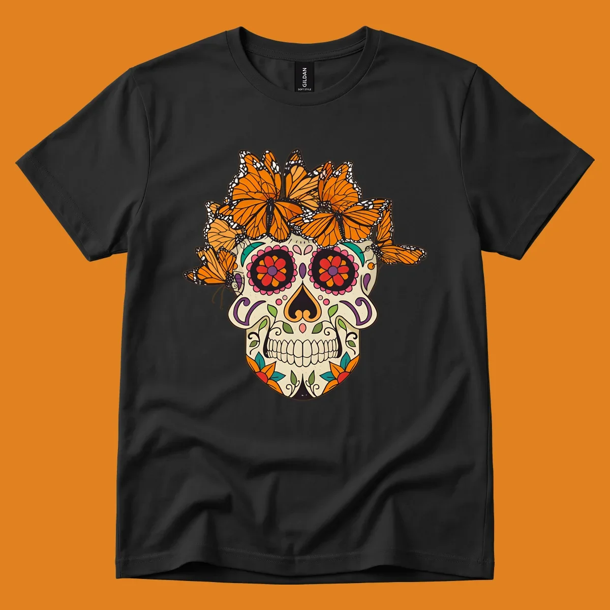 A cream sugar skull with colorful floral patterns and a crown of orange and black monarch butterflies.