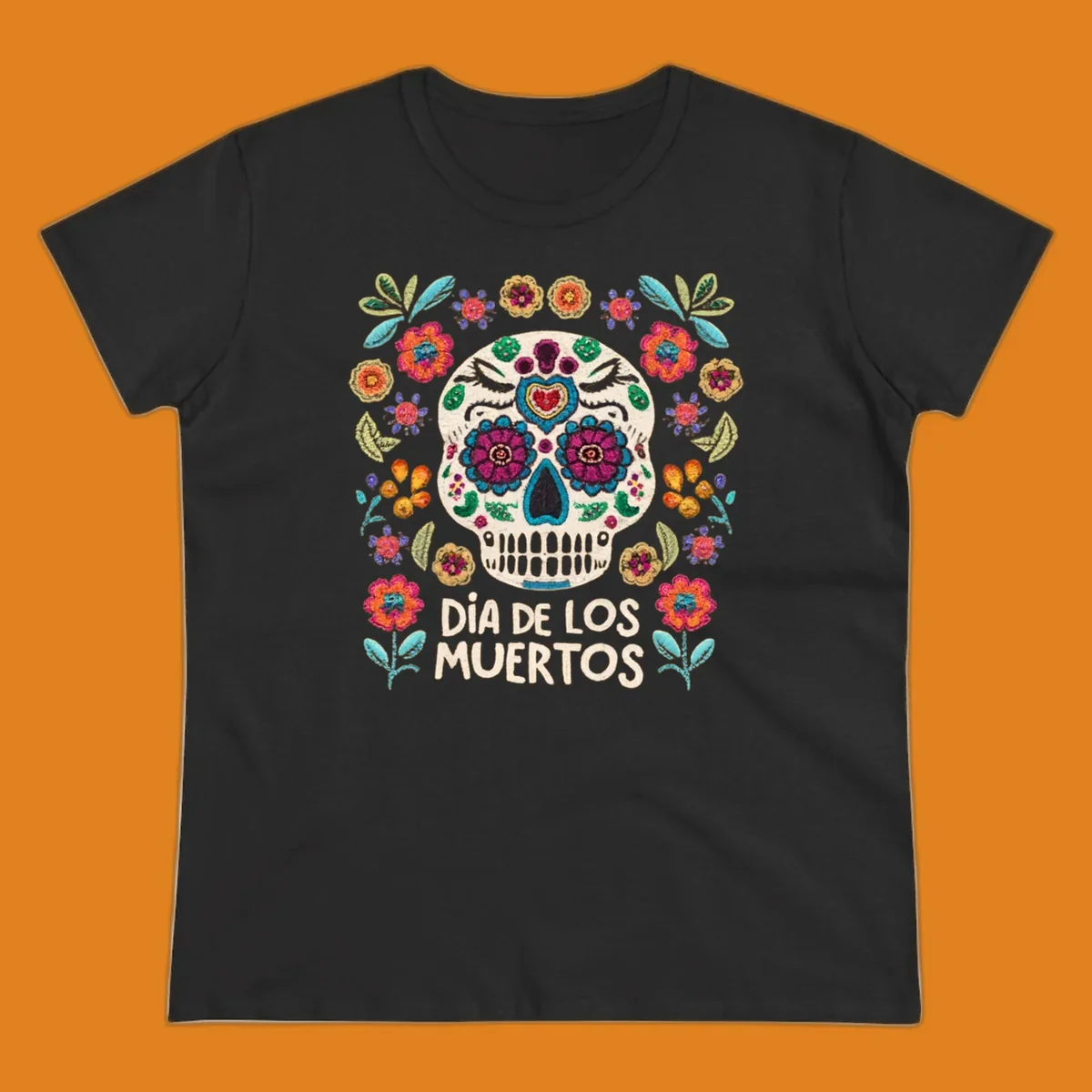 Embroidered-style Día de los Muertos sugar skull with colorful flowers and leaves, and text 'DÍA DE LOS MUERTOS'.