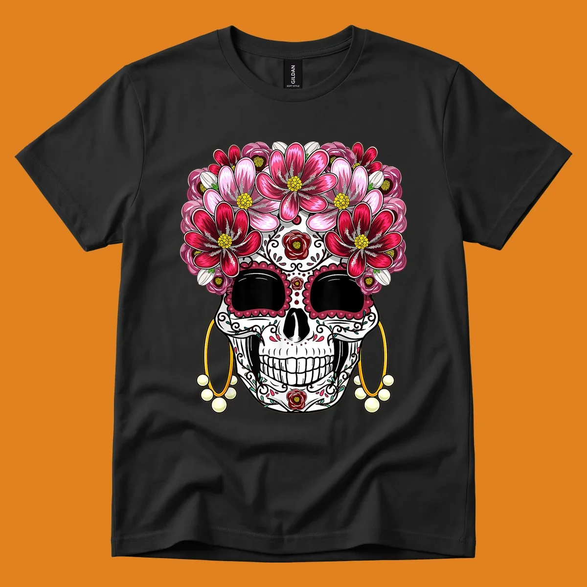 An ornate floral sugar skull with a crown of pink and red flowers, scrollwork, and pearl earrings on a black background.