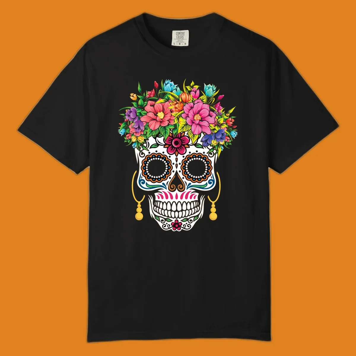 A vibrant floral calavera skull with a large, colorful flower crown and decorative patterns, featuring gold earrings.
