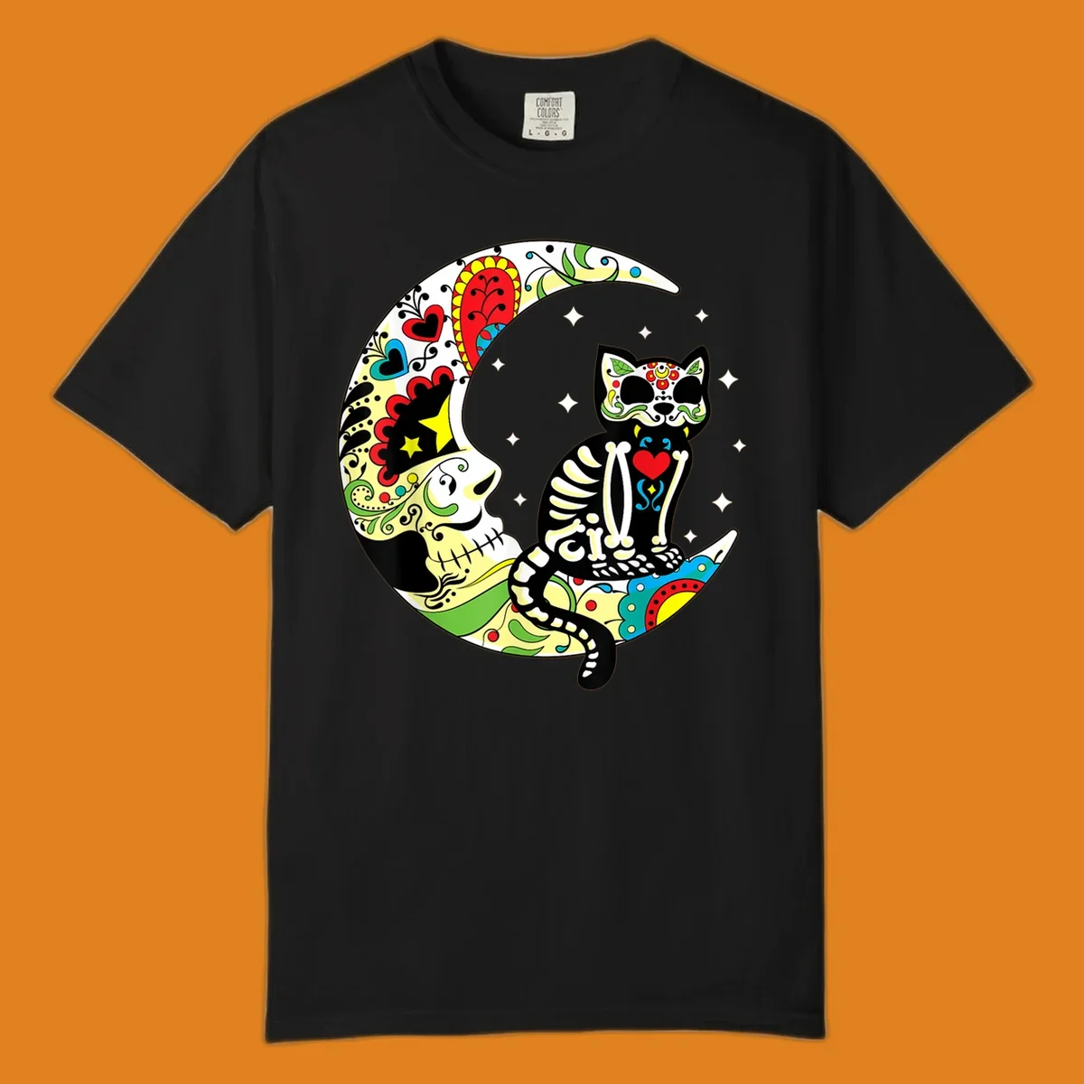 A colorful sugar skull cat with a skeleton body sits on a crescent moon decorated with skull and floral patterns. Features a sugar-skull-cat-moon.