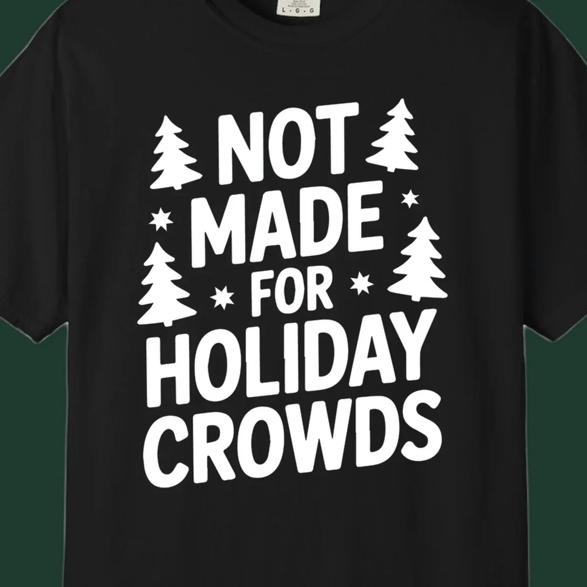 Typography design with 'NOT MADE FOR HOLIDAY CROWDS' text, Christmas trees, and stars.