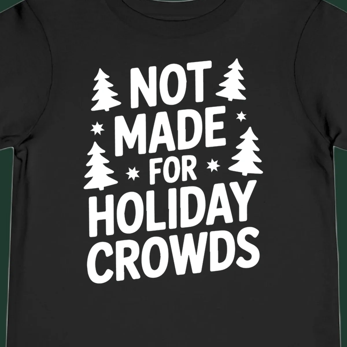 Typography design with 'NOT MADE FOR HOLIDAY CROWDS' text, Christmas trees, and stars.