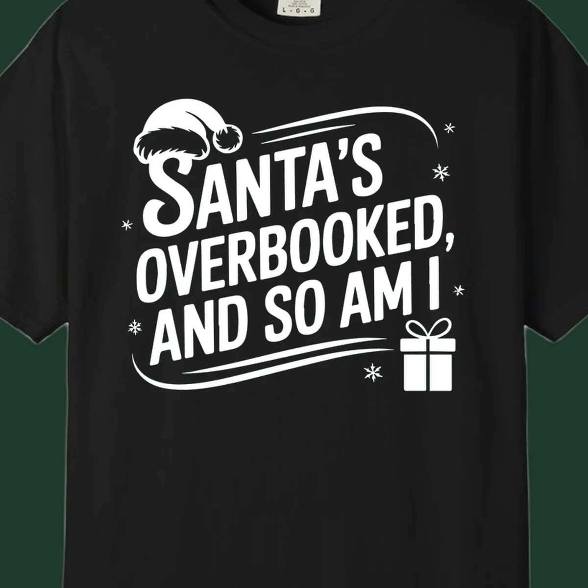 Santa's overbooked and so am I graphic with Santa hat and gift box.