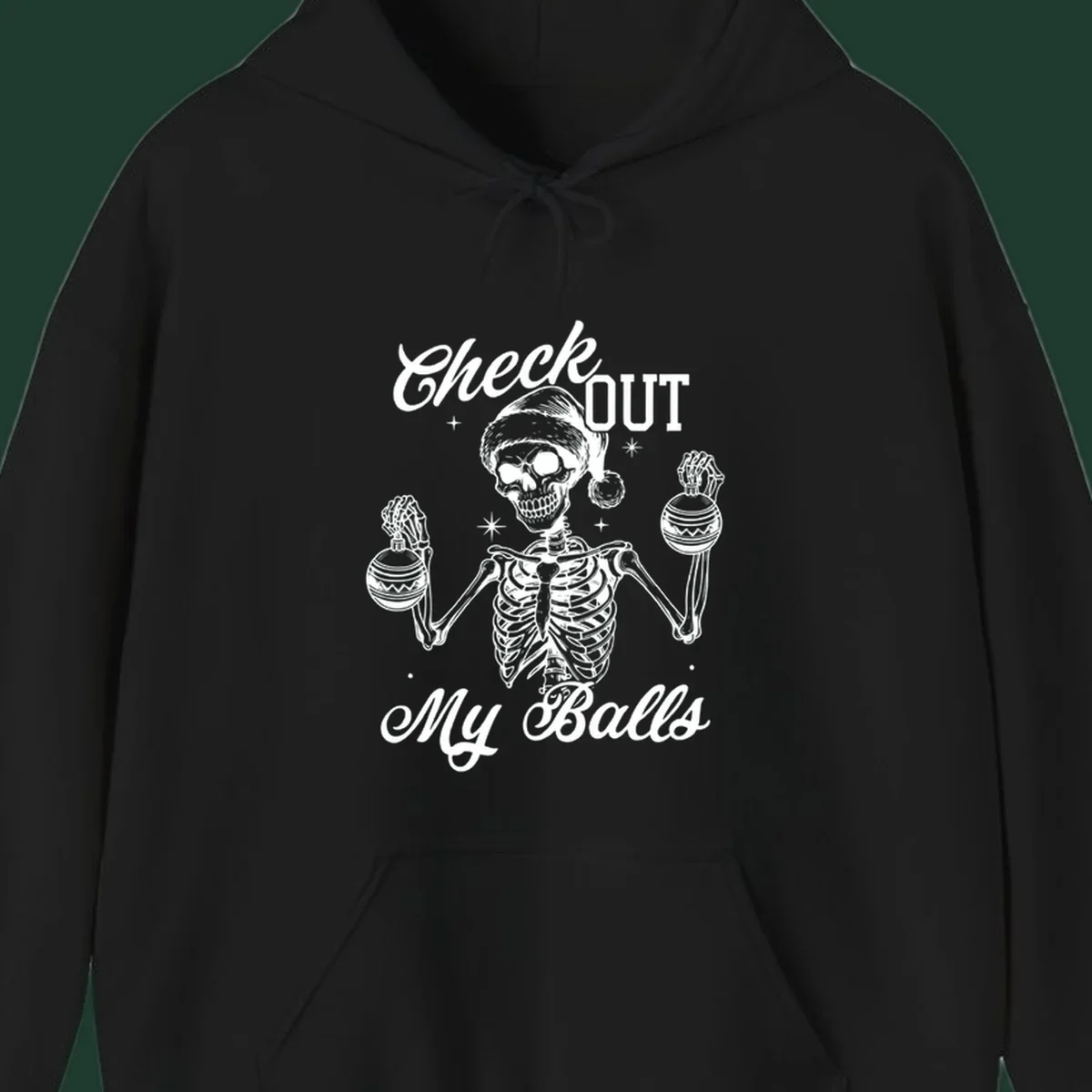 Skeleton wearing a Santa hat and holding Christmas ornaments, with text 'Check OUT My Balls'.