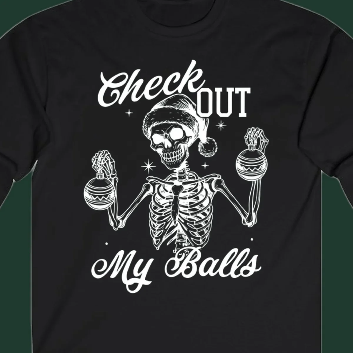 Skeleton wearing a Santa hat and holding Christmas ornaments, with text 'Check OUT My Balls'.