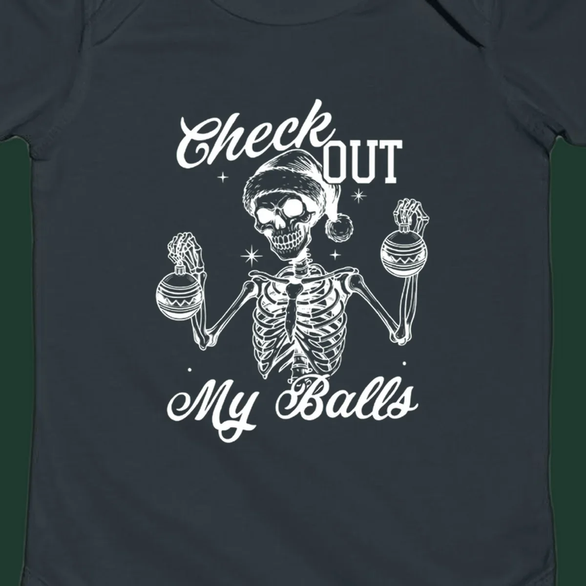Skeleton wearing a Santa hat and holding Christmas ornaments, with text 'Check OUT My Balls'.