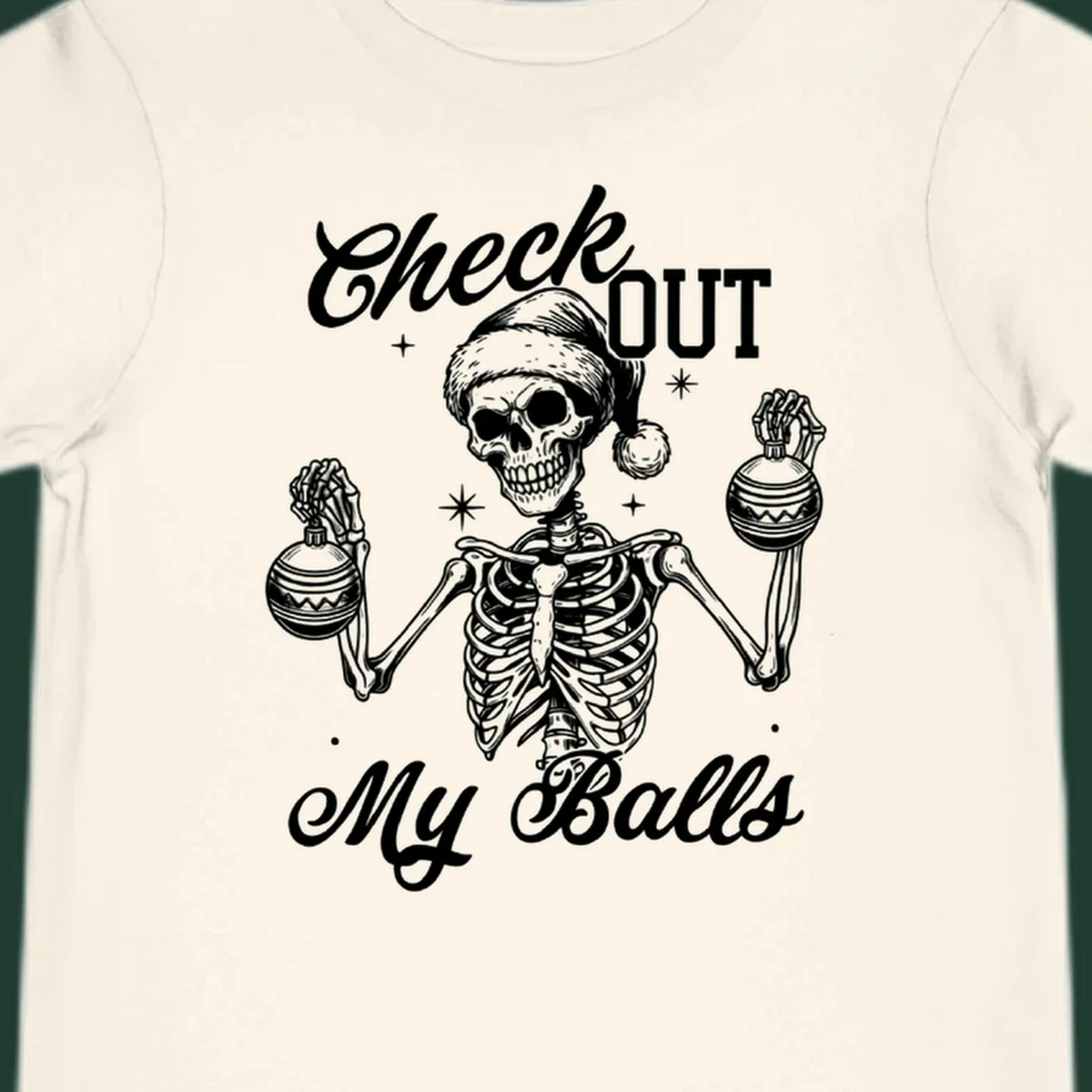 Skeleton wearing a Santa hat and holding Christmas ornaments, with text 'Check OUT My Balls'.