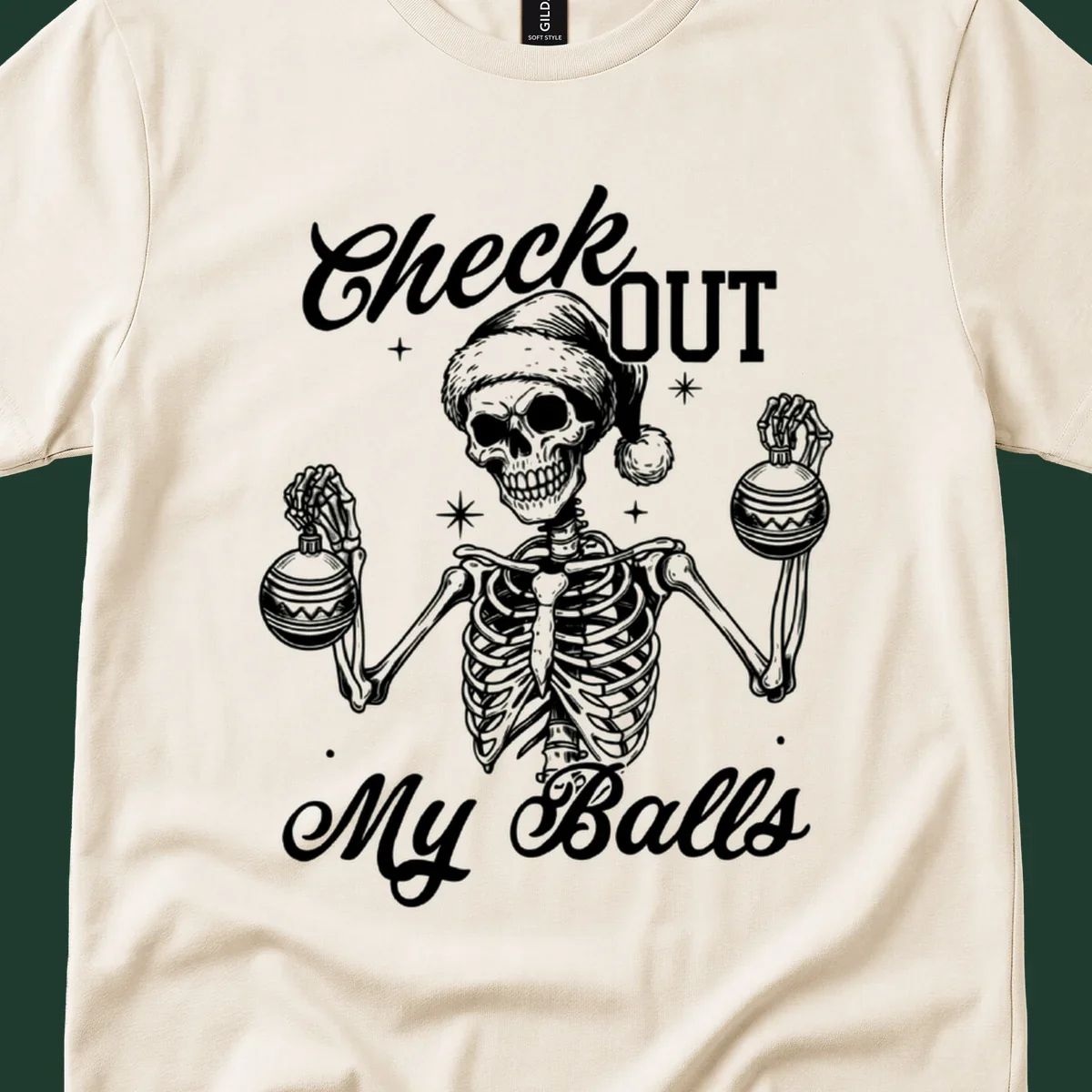 Skeleton wearing a Santa hat and holding Christmas ornaments, with text 'Check OUT My Balls'.
