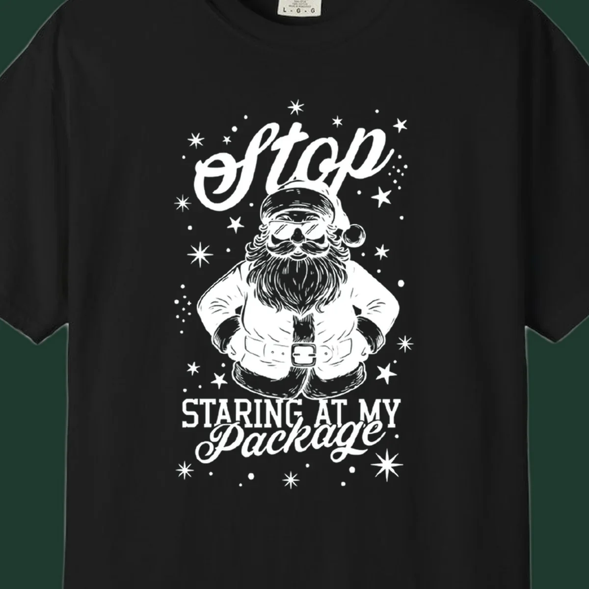 Santa Claus wearing sunglasses with the text 'Stop STARING AT MY Package', part of the santa-package-joke concept.