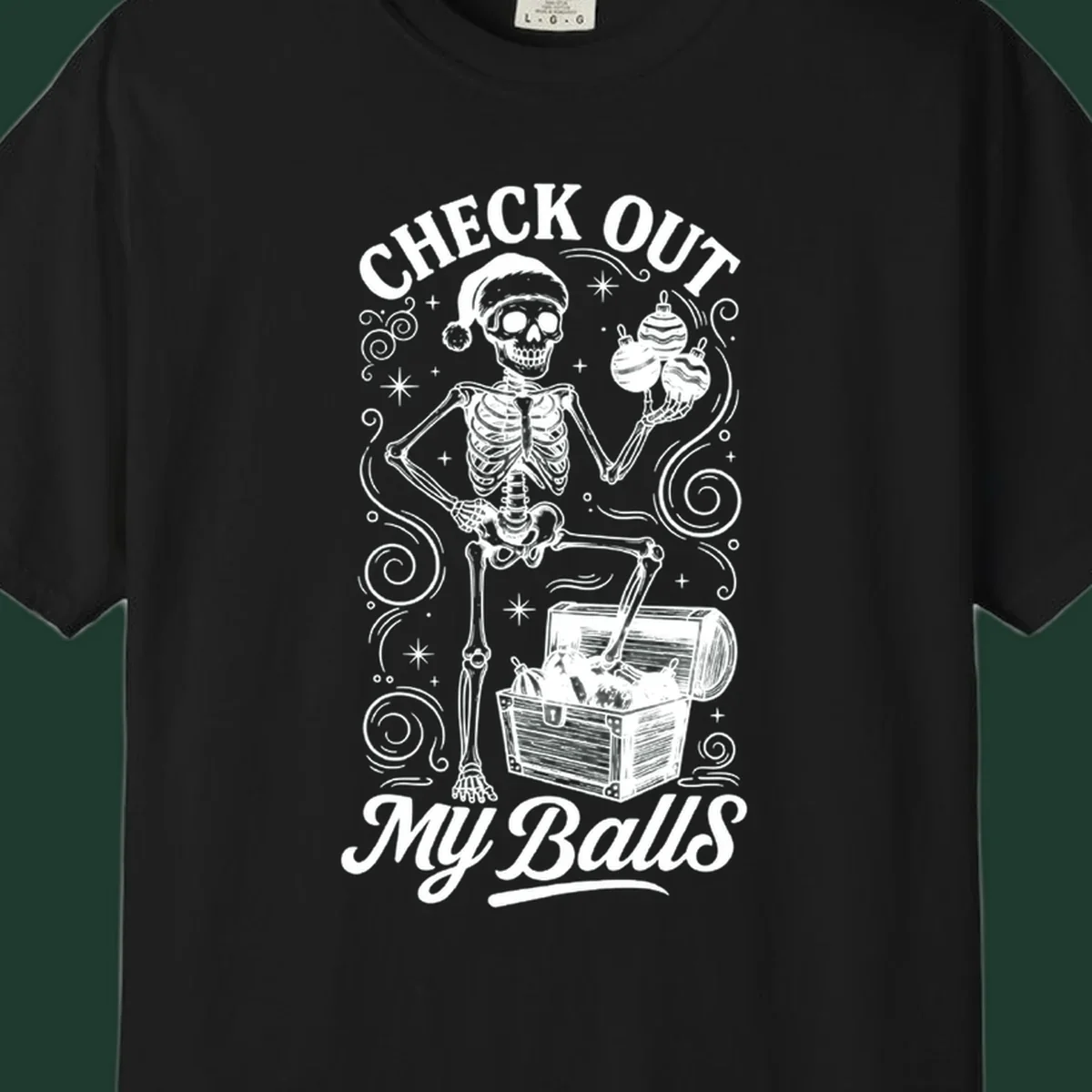 Skeleton in Santa hat holding ornaments next to treasure chest, with text 'CHECK OUT MY Balls'.
