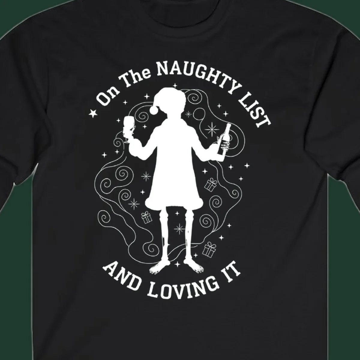 Silhouette of person in Santa hat holding wine, text 'Naughty List And Loving It'.