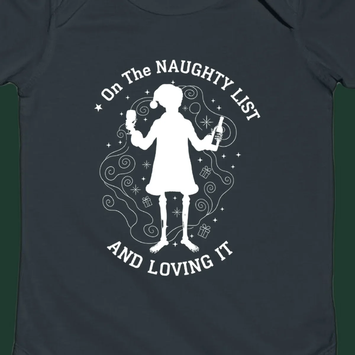 Silhouette of person in Santa hat holding wine, text 'Naughty List And Loving It'.