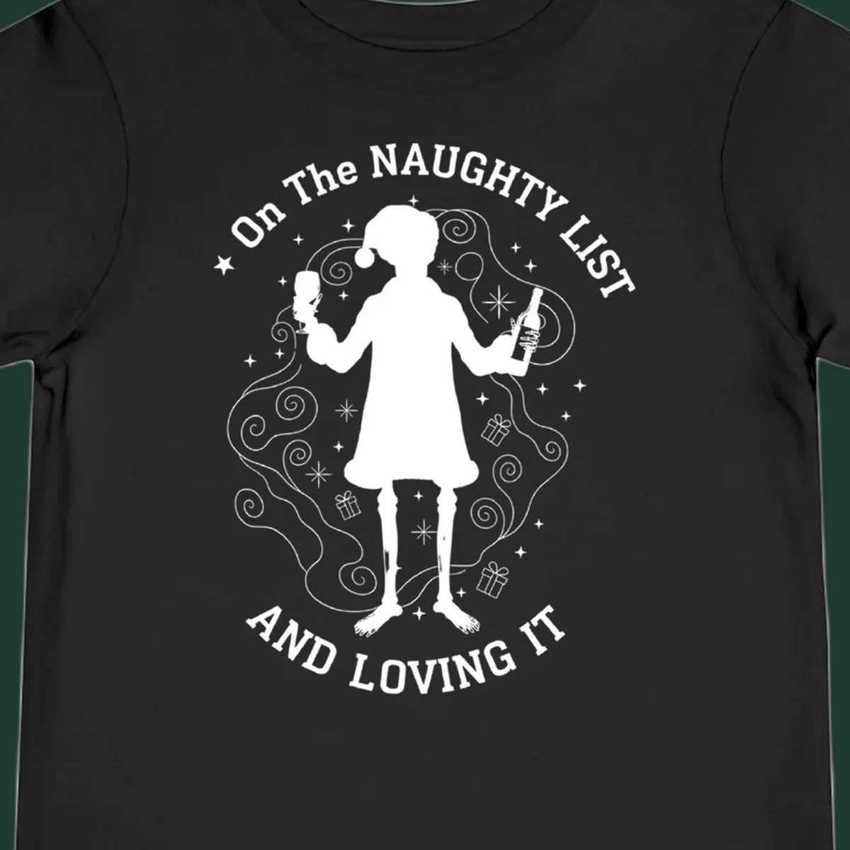 Silhouette of person in Santa hat holding wine, text 'Naughty List And Loving It'.
