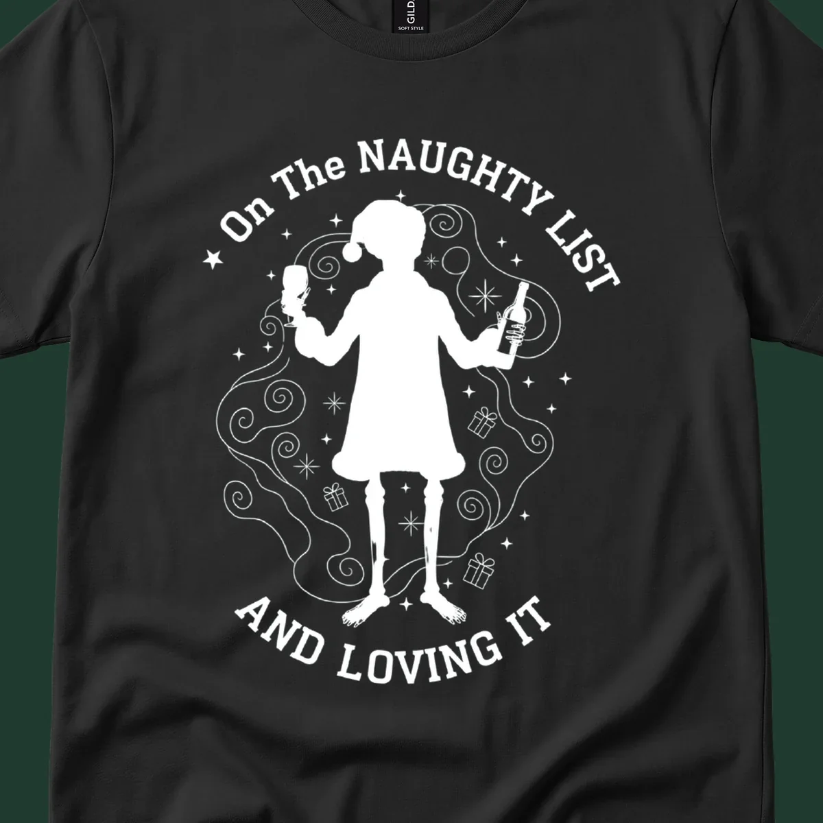 Silhouette of person in Santa hat holding wine, text 'Naughty List And Loving It'.