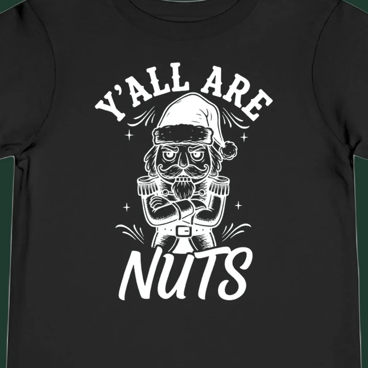 Nutcracker illustration with 'Y'ALL ARE NUTS' text, a holiday graphic.