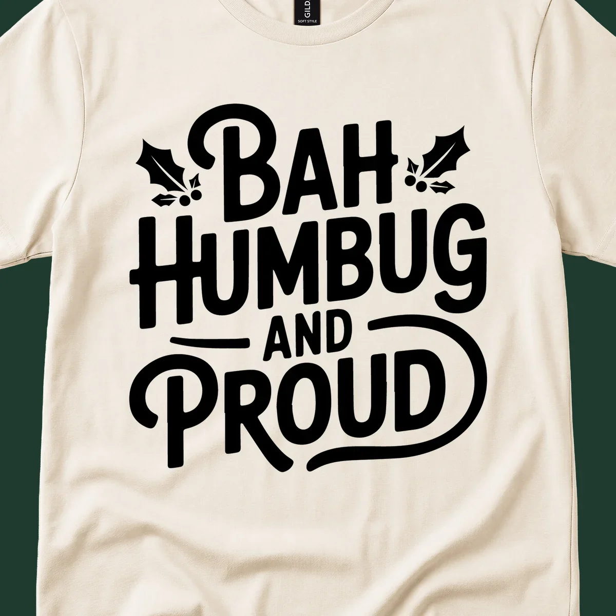 Bah humbug and proud typography design with holly leaves.