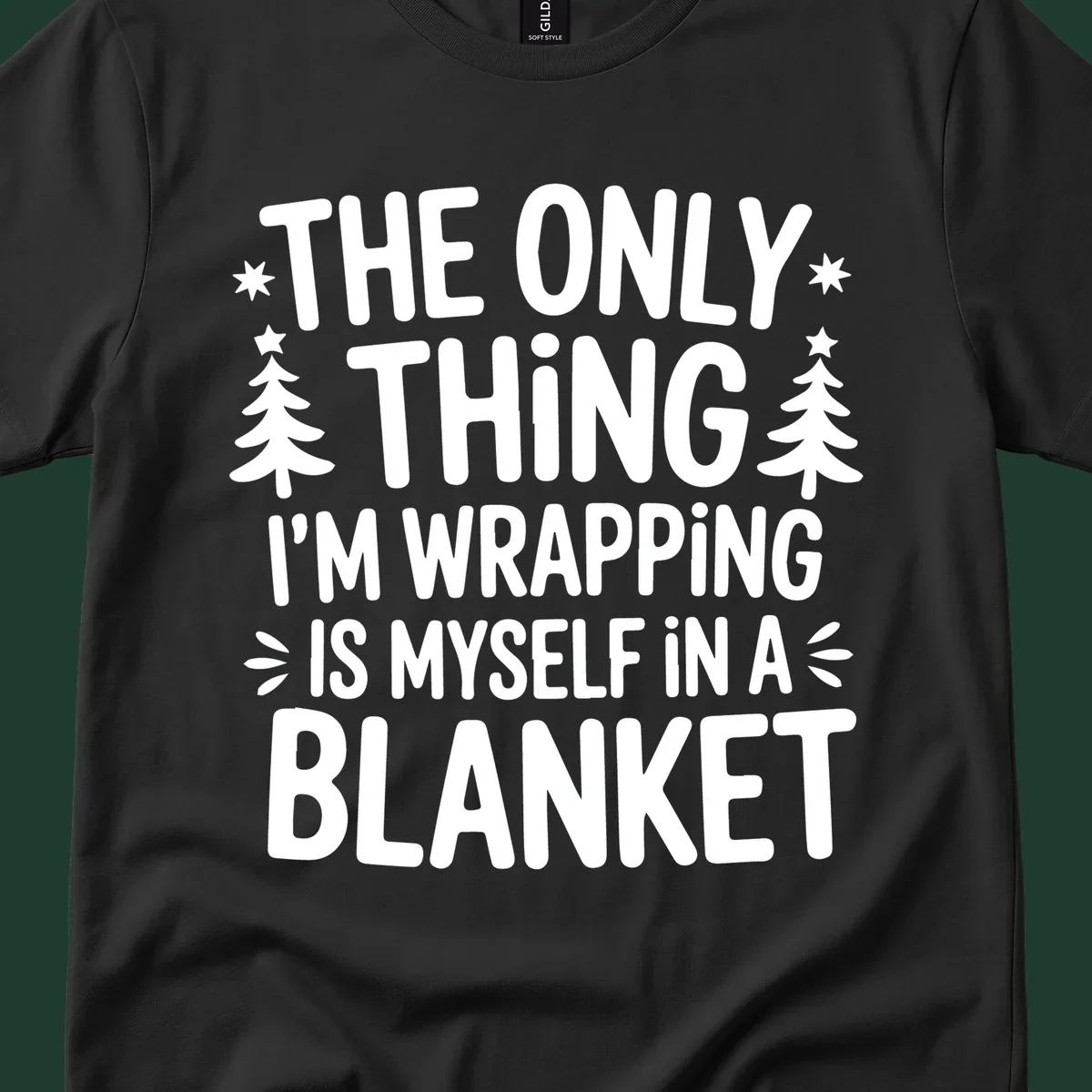 The Only Thing I'm Wrapping Is Myself In A Blanket text design with stars and Christmas trees.