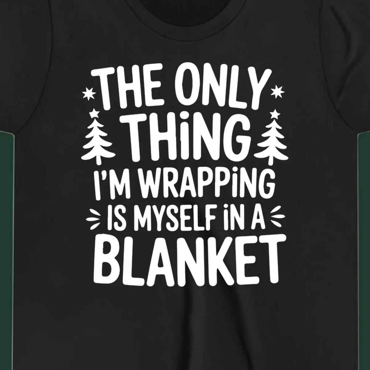 The Only Thing I'm Wrapping Is Myself In A Blanket text design with stars and Christmas trees.