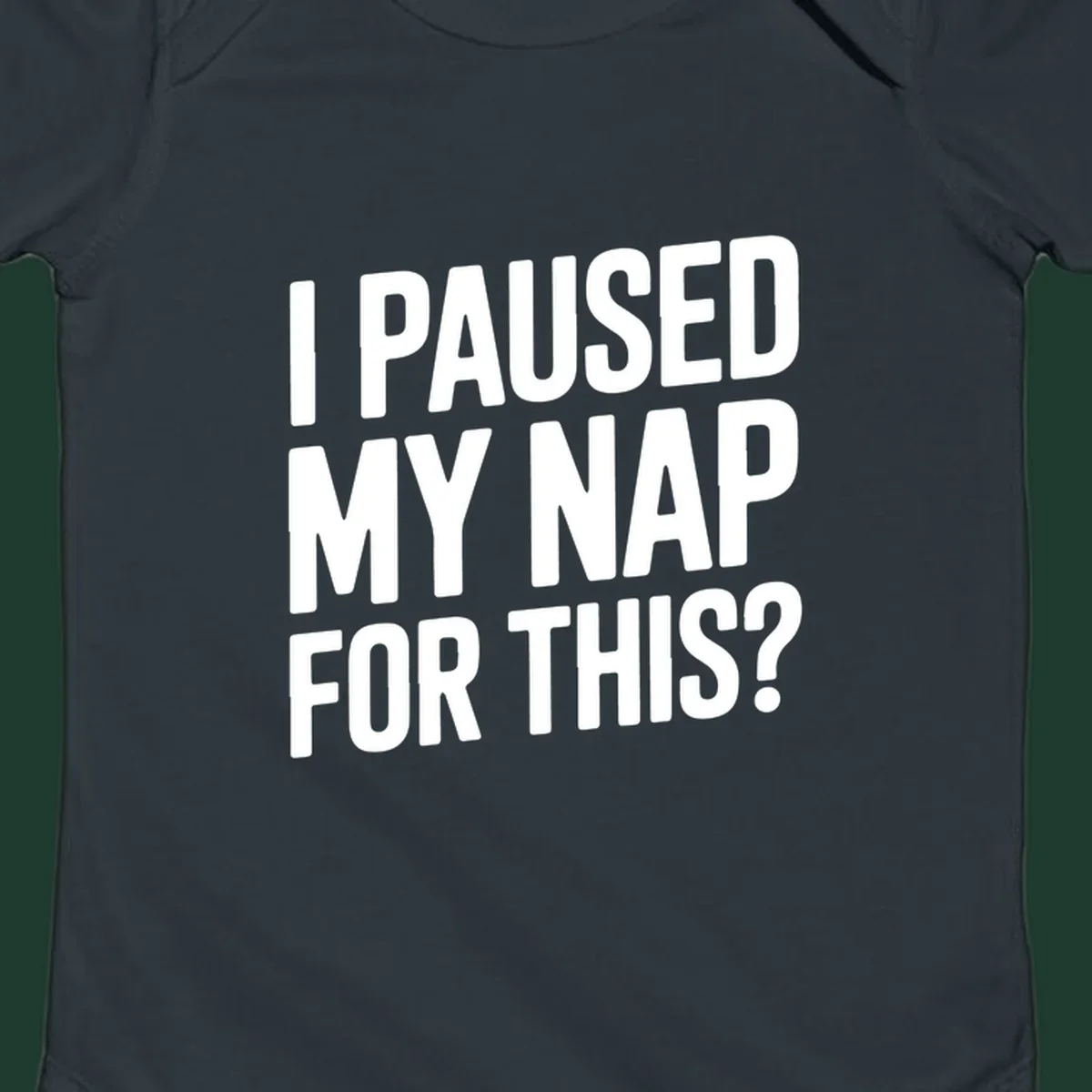 White typography quote 'I PAUSED MY NAP FOR THIS?' on a black background.