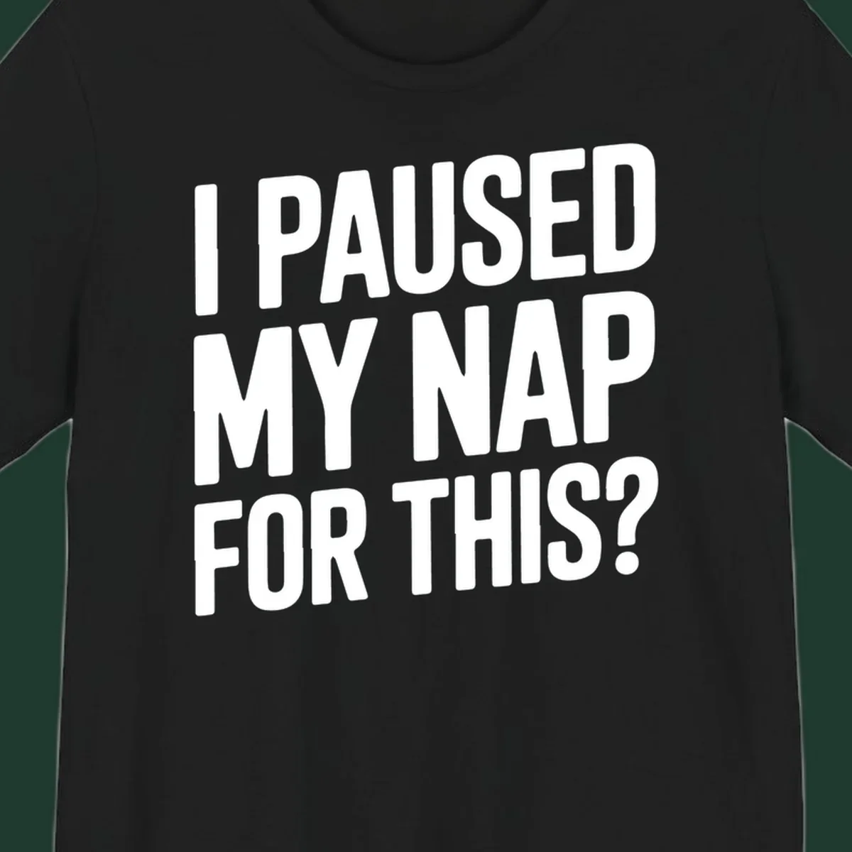 White typography quote 'I PAUSED MY NAP FOR THIS?' on a black background.