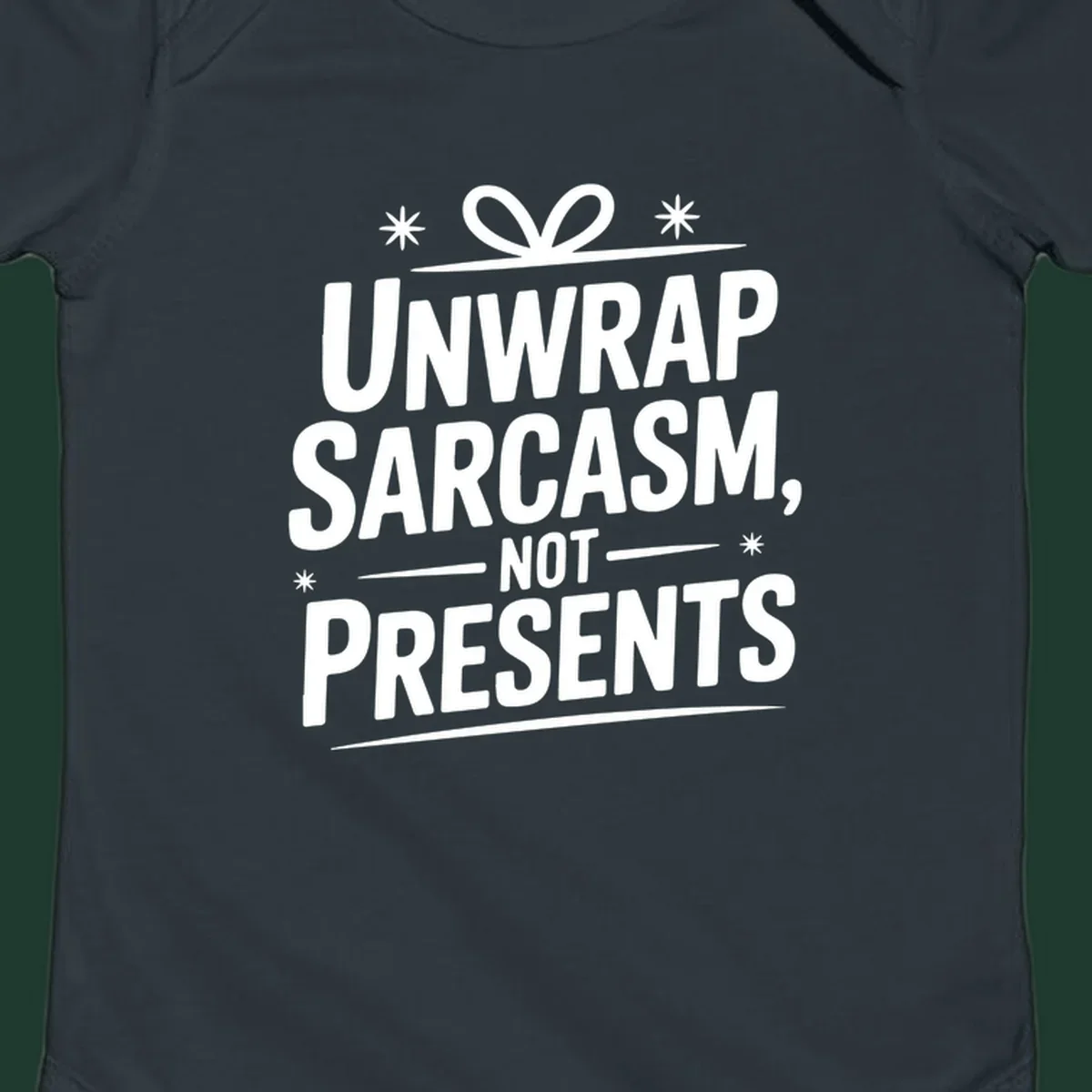 Unwrap Sarcasm Not Presents text design with snowflakes and gift ribbon.