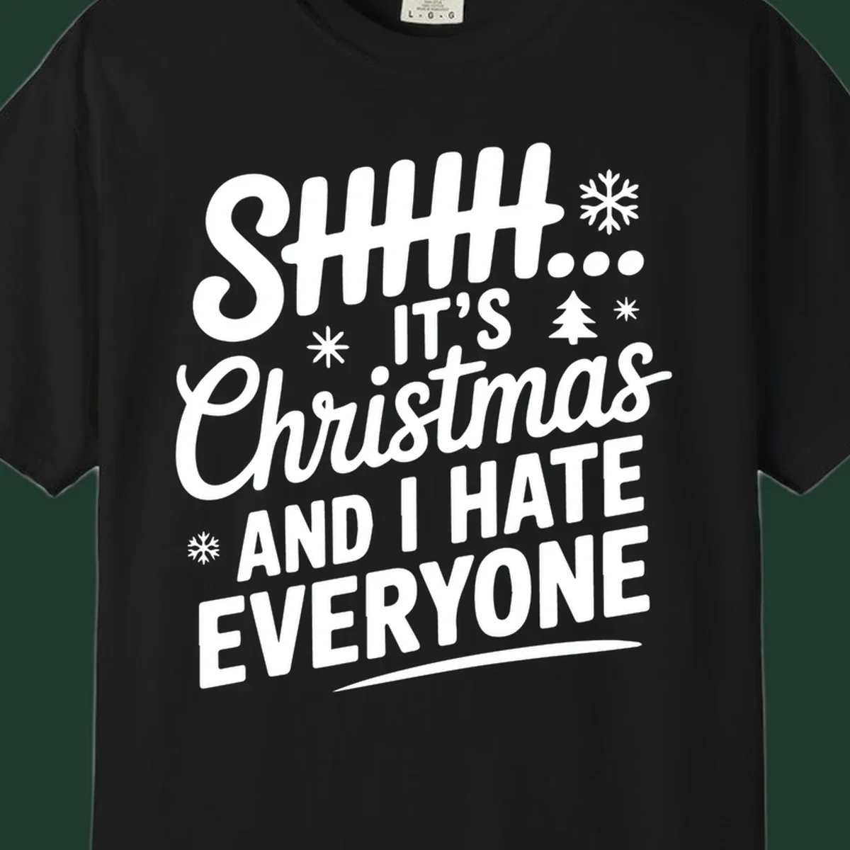 Shhh It's Christmas And I Hate Everyone text design with snowflake and tree graphics.