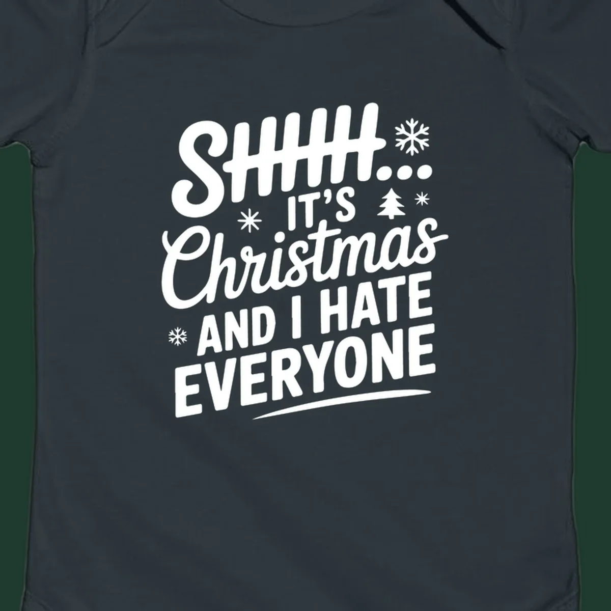 Shhh It's Christmas And I Hate Everyone text design with snowflake and tree graphics.