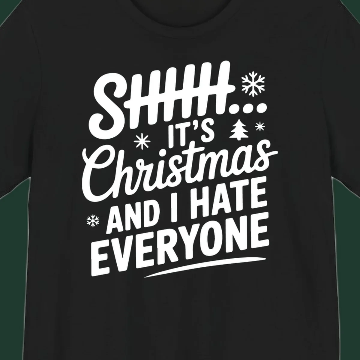 Shhh It's Christmas And I Hate Everyone text design with snowflake and tree graphics.