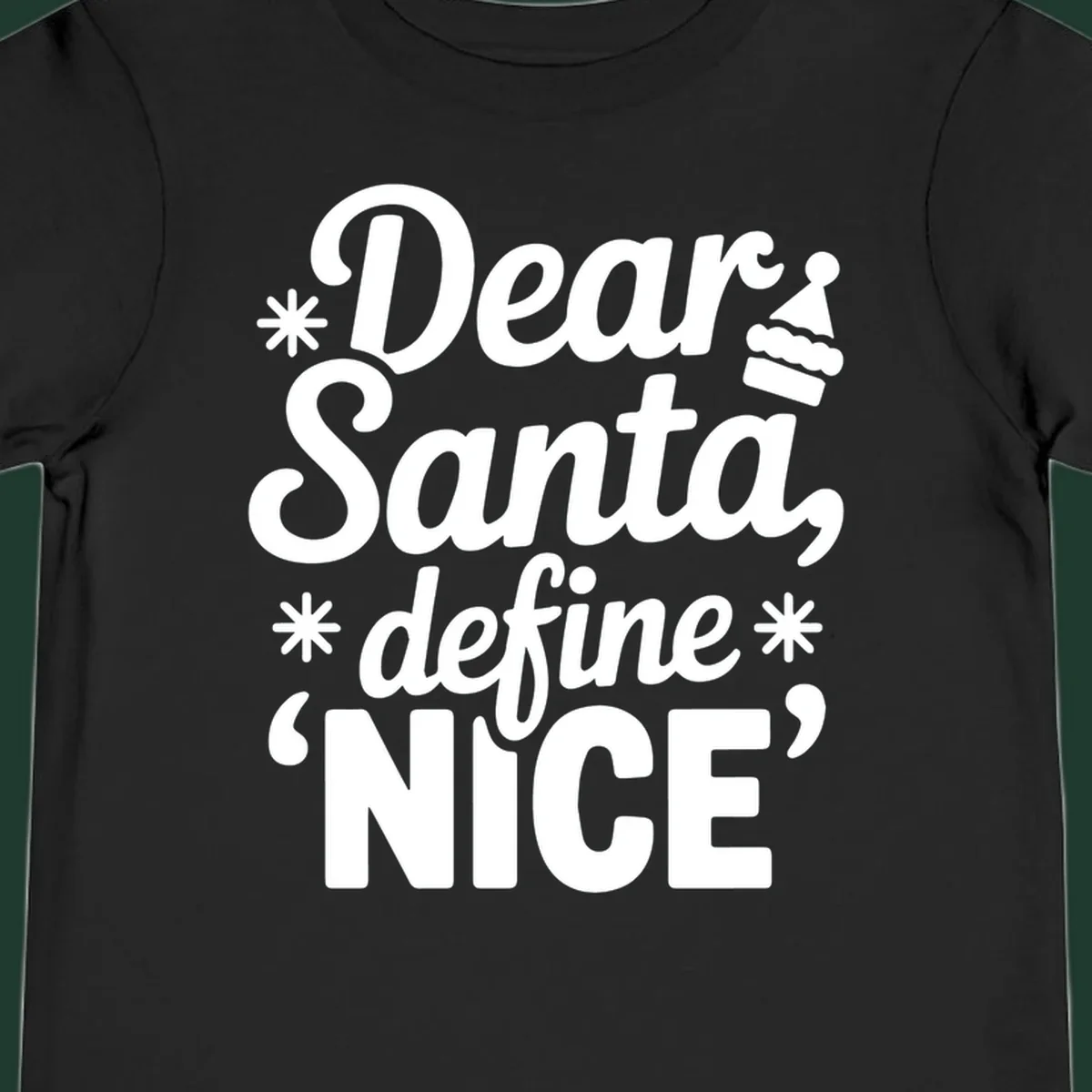 Black t-shirt design with white text asking 'Dear Santa, define NICE', accented by snowflakes and a Santa hat.