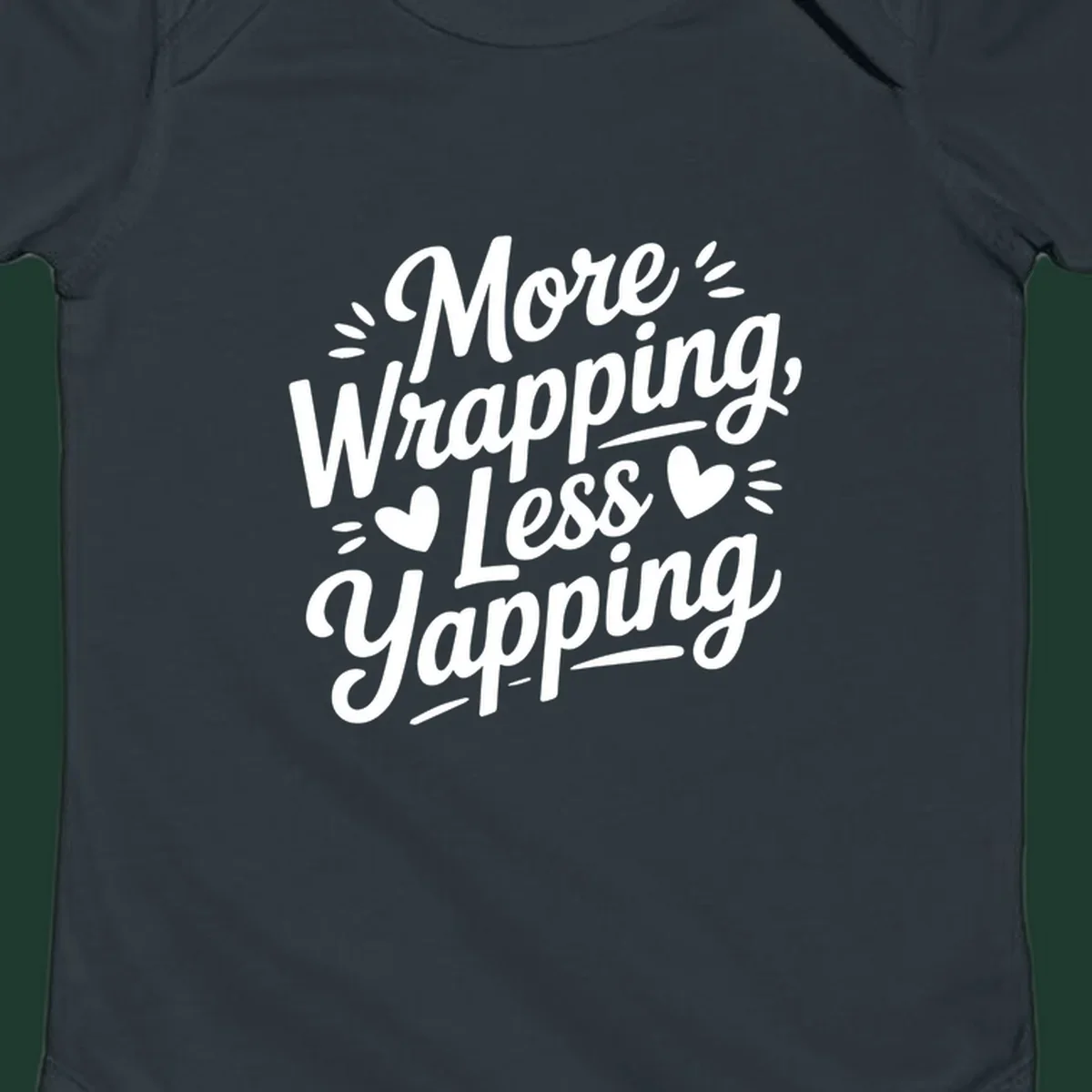 More Wrapping Less Yapping typography design with hearts and dashes.