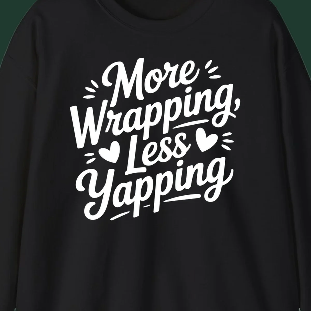 More Wrapping Less Yapping typography design with hearts and dashes.