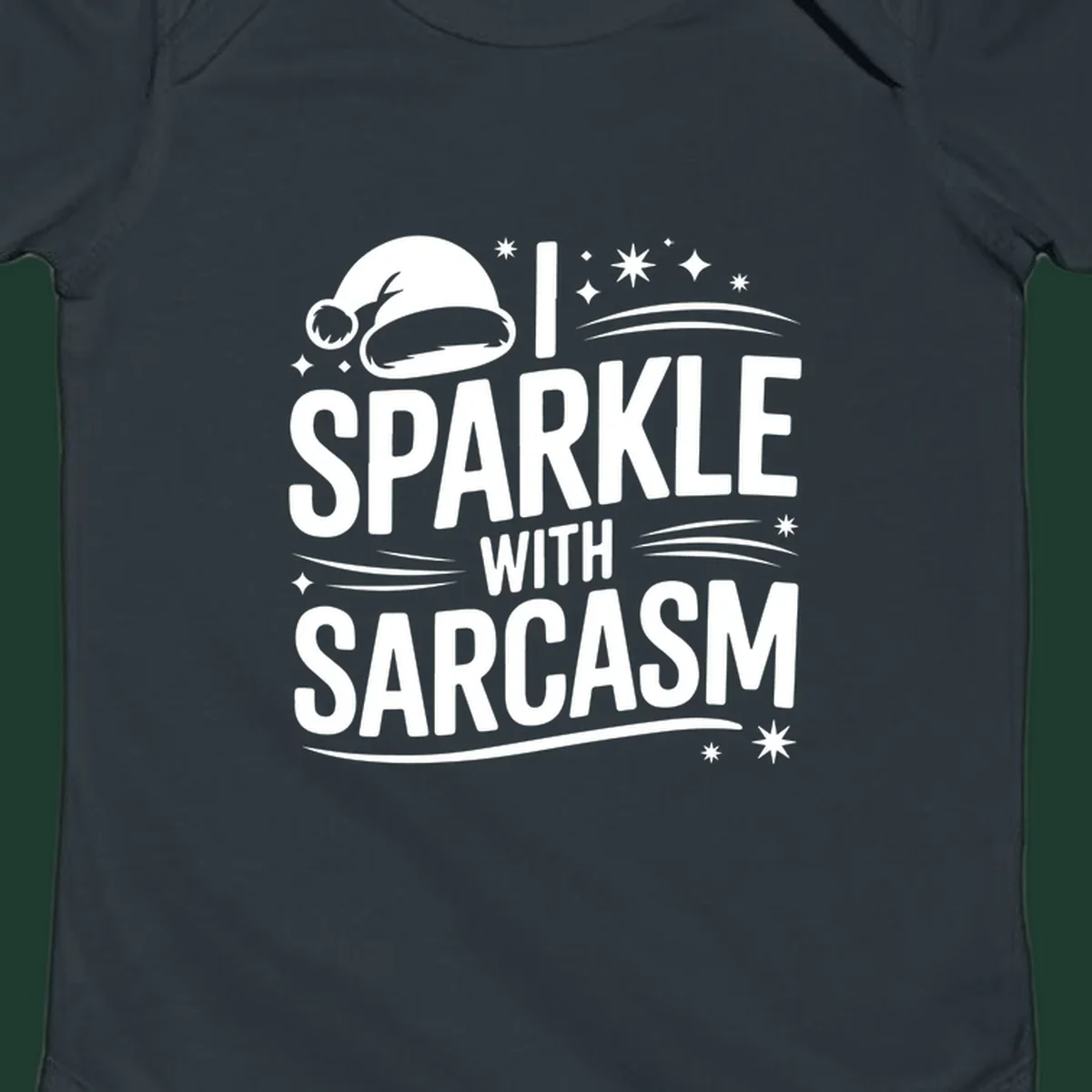 Graphic with Santa hat and text 'I SPARKLE WITH SARCASM', featuring stars and swirls.