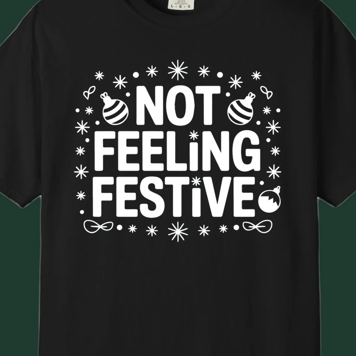 Not feeling festive graphic tee with text and winter elements.