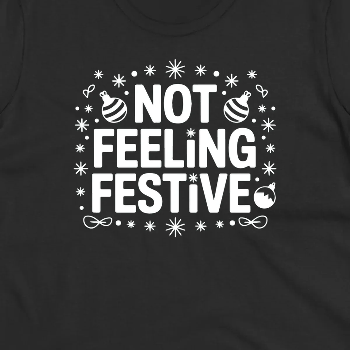 Not feeling festive graphic tee with text and winter elements.