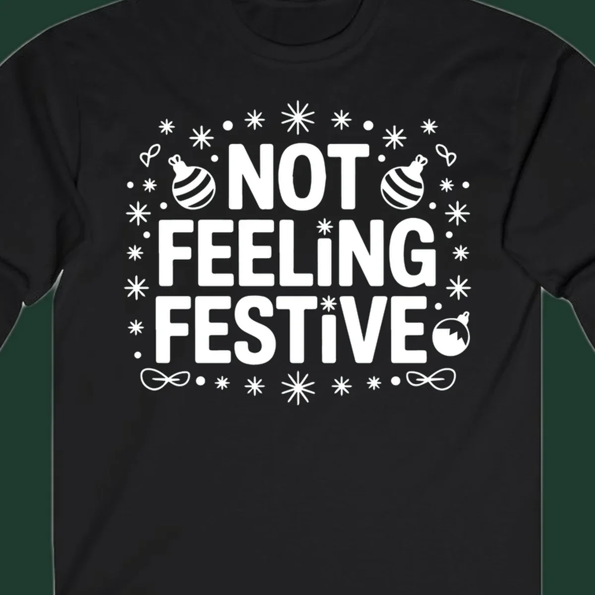 Not feeling festive graphic tee with text and winter elements.