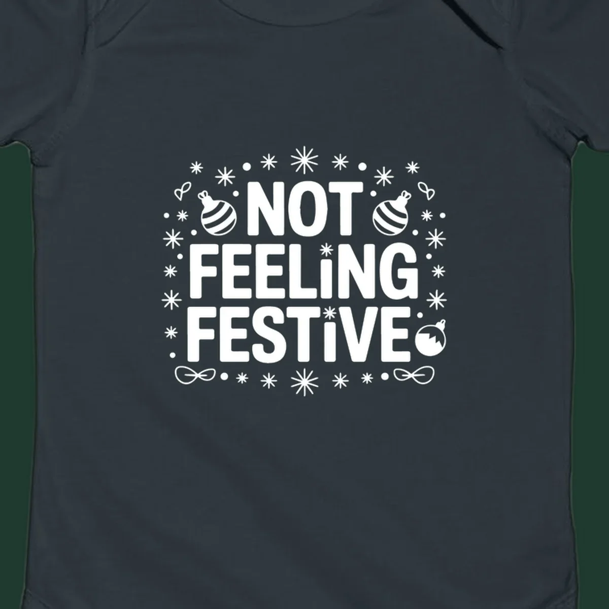 Not feeling festive graphic tee with text and winter elements.