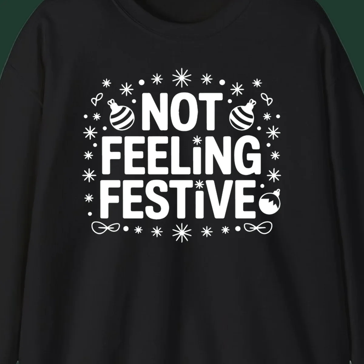 Not feeling festive graphic tee with text and winter elements.
