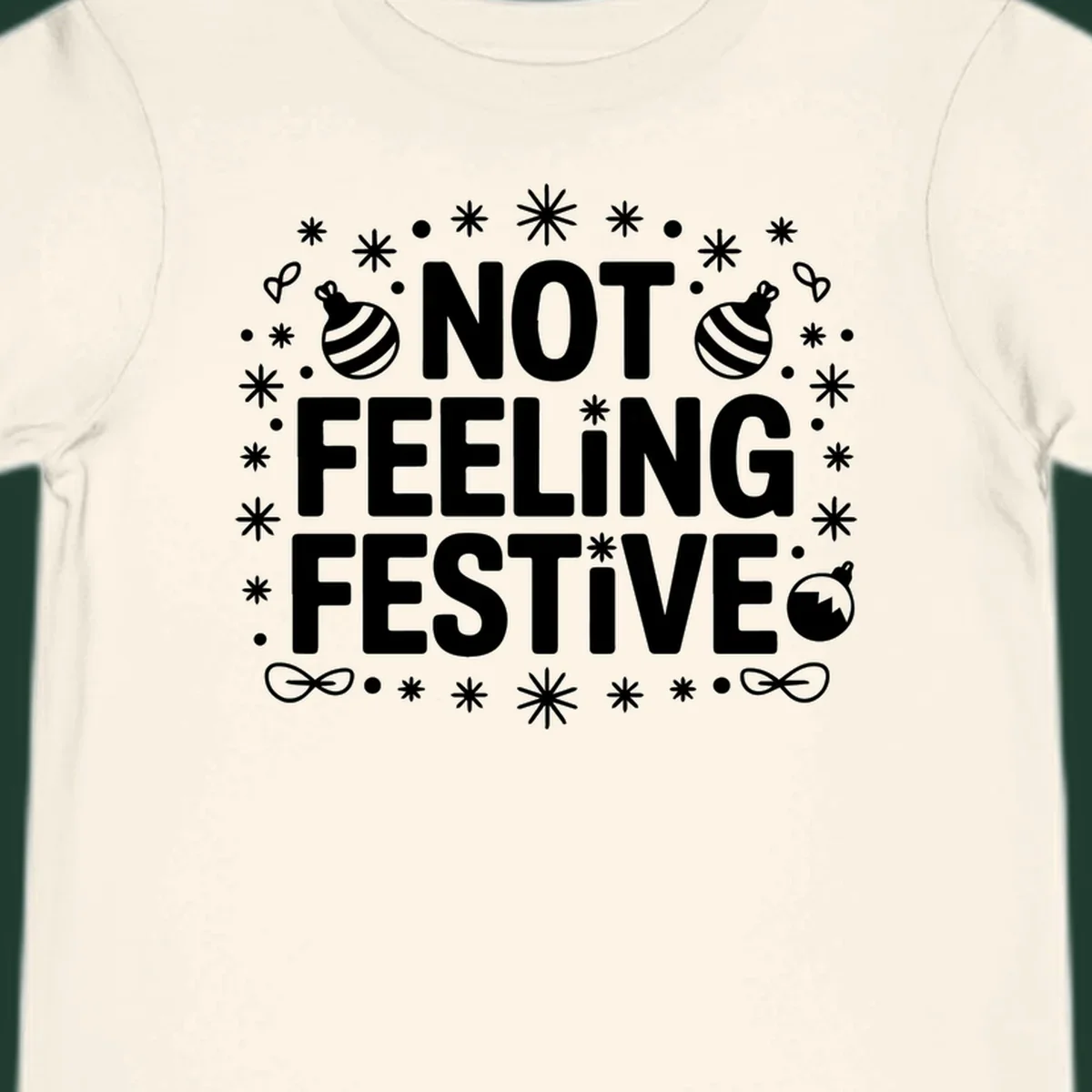 Not feeling festive graphic tee with text and winter elements.