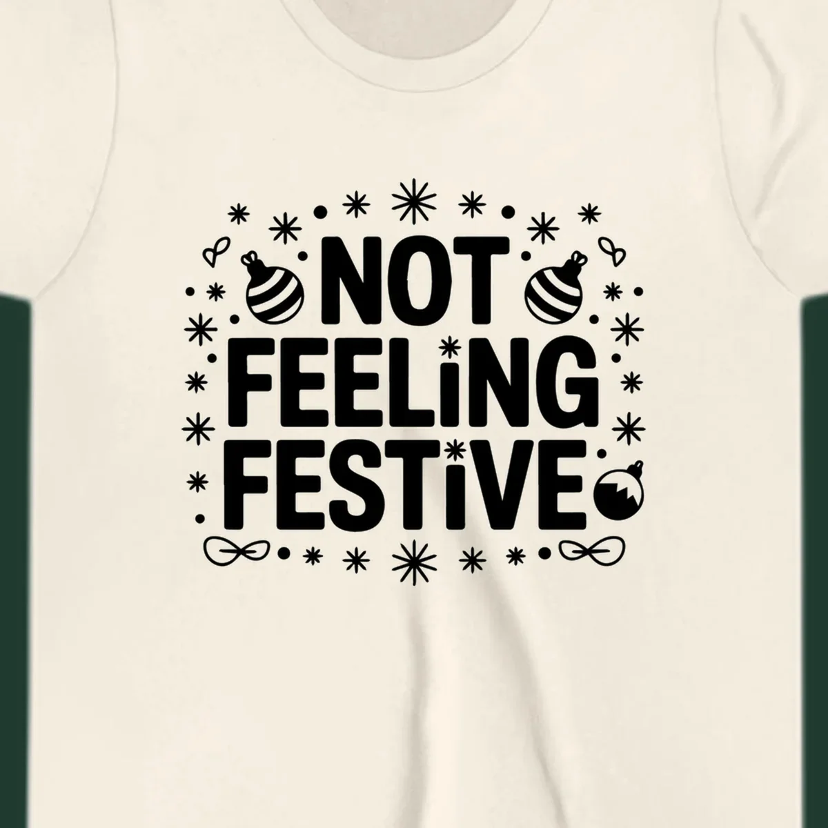 Not feeling festive graphic tee with text and winter elements.