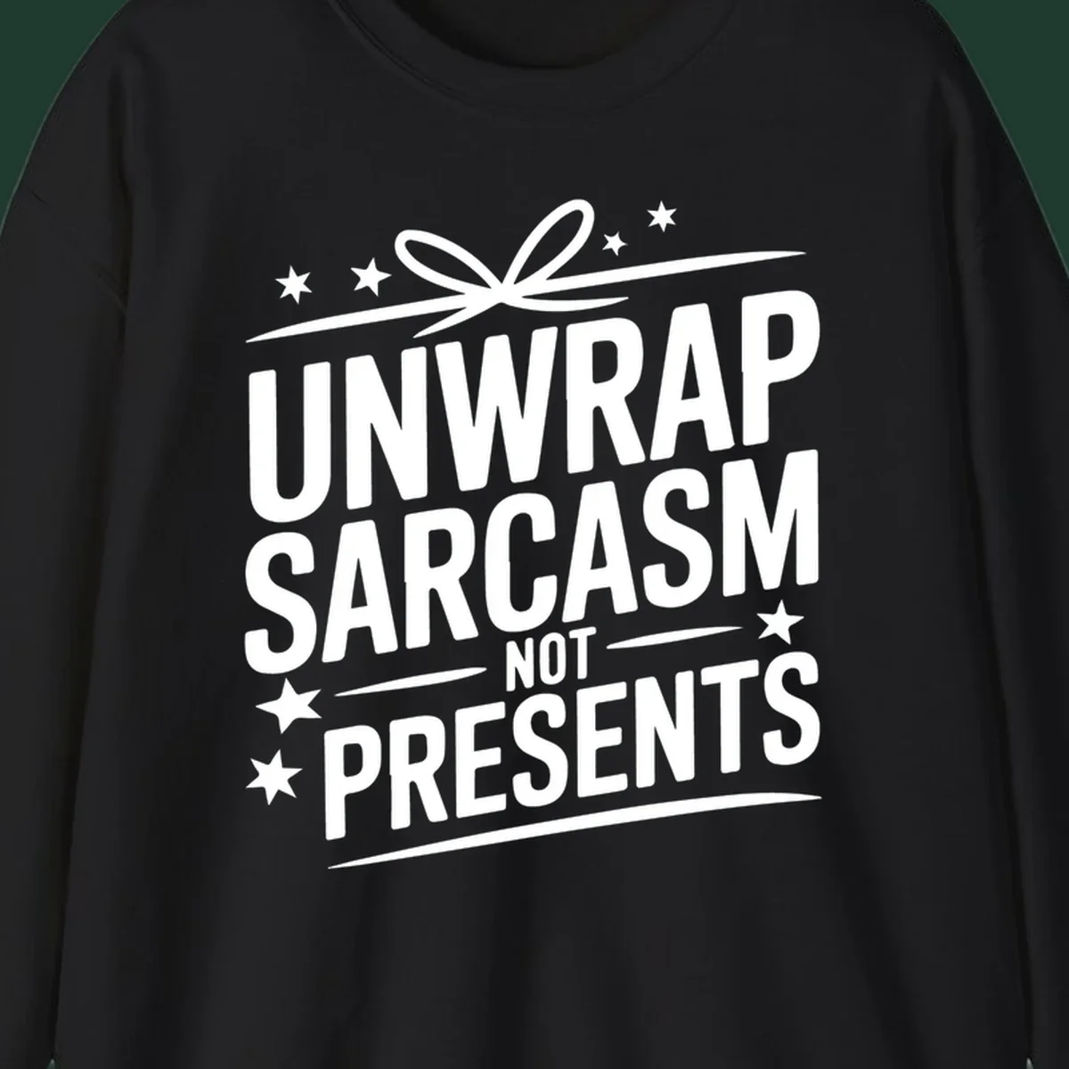 Unwrap Sarcasm Not Presents typography design with gift bow and stars.